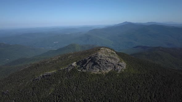 Aerial footage of a mountain summit.