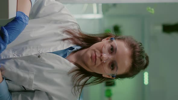 Vertical Video Pov of Biologist Researcher Woman with Medical Equipment