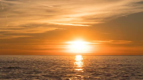 Beautiful Sunset Over the Sea in the Clouds. Time Lapse