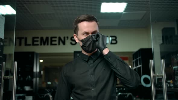 Confident Barber in Mask at Barbershop Entrance