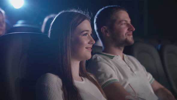 Couple Watching Comedy, Eating Popcorn in Cinema.