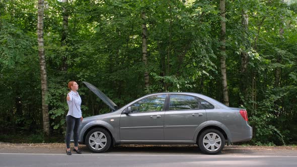 Woman Trying To Stop the Car on the Road. 