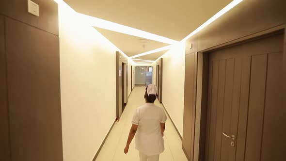 Nurse Walks Through Hospital Ward 2  