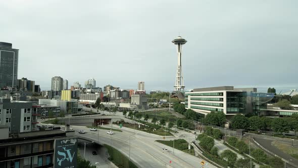 Iconic downtown Seattle, Washington under gray overcast skies, aerial push