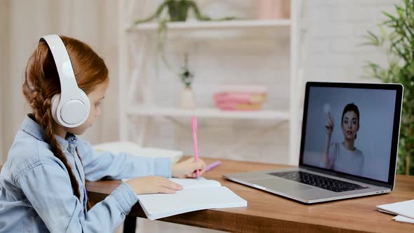 Little Child Girl Using Laptop Computer for Studying Online E-learning System