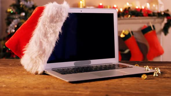 Santa hat hanging on laptop