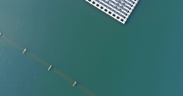 Aerial View of Floating Solar Panels Cell Platform System on the Pond
