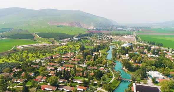 Aerial view of the town with hills in the background and Kibbutzim Stream.