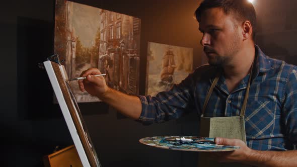 Talented Hipster Artist is Drawing Painting Using Paint Brush To Create New Concept Art alt