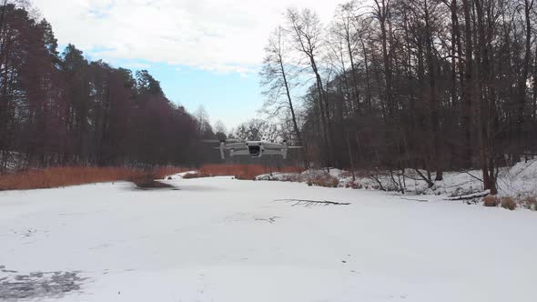 Drone Flies In The Winter Forest