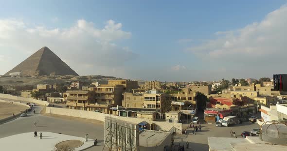 Woman taking photos of beautiful Giza pyramids complex