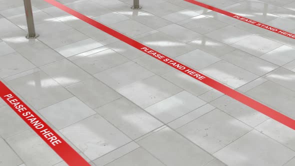 Red Queue Lines on the Floor and Social Distance in the Public Places