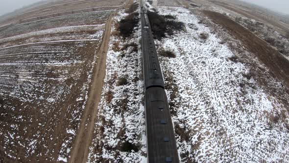 Close-up of aing train, followed by the drone. Aerial Video