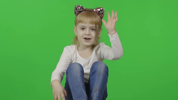 Girl in Jeans and Headband with a Cat Ears