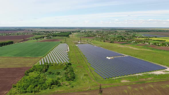 Drone Footage of a Massive Solar Power Station in a Field, Landscape, 