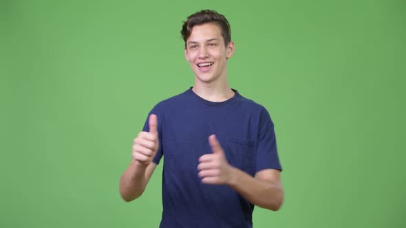 Young Handsome Teenage Boy Giving Thumbs Up