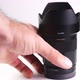 Hand picks up the photo lens - VideoHive Item for Sale