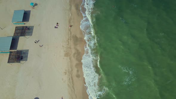 Aerial Point of View To Sandy Seaside with Resorts, Sun Umbrellas and Attractions on Beach