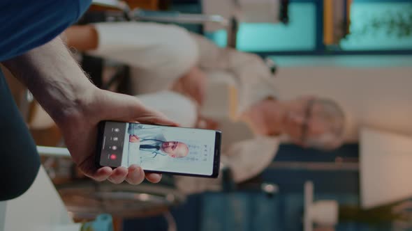 Vertical Video Elder Adult Using Video Call to Talk to Doctor About Treatment