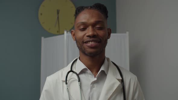 Portrait of Cheerful Young Male Doctor or Medical Intern Indoors