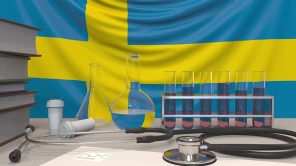 Laboratory Equipment on Swedish Flag Background alt