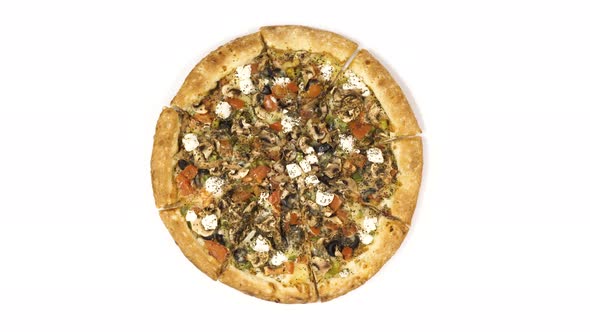 Rotating Pizza with Smoked Sausage and Olives on a White Background. Top View Center Orientation