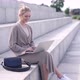 Stylish Woman Using Laptop on Street - VideoHive Item for Sale