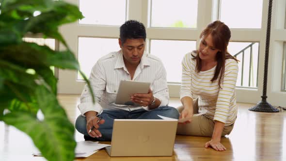 Couple working out finances in their new home