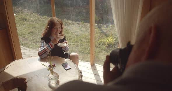 a Middle Aged Woman Poses in Her Country Home for Her Husband Who Takes Photos