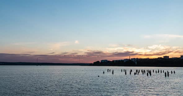 Stunning Panoramic Views of the Bay Against the Horizon with Sunset and Orange Skies Under Heavy