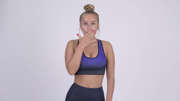 Young Beautiful Blonde Woman Looking Shocked Ready for Gym