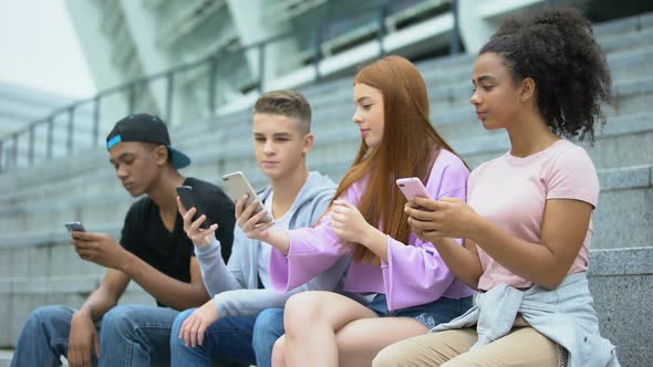 Teen Girl Showing Friends New Photo in Social Network, Technology Addiction