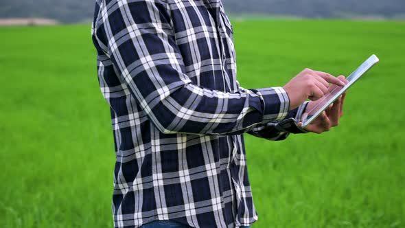 Agronomist Using a Tablet in an Agricultural Field