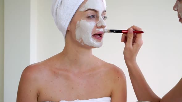 Beautiful Woman Having a Facial Treatment at Spa