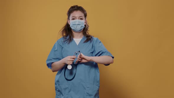 Portrait of Woman Medic Wearing Covid Mask for Protection