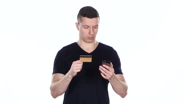 Man Shopping with a Credit Card and Smartphone. White