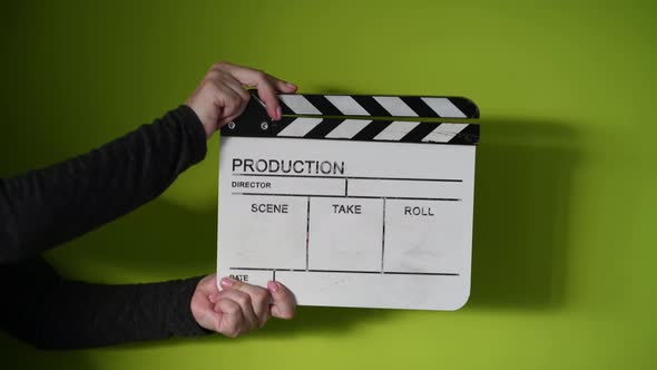 Human Hands Hold and Clap with Clapperboard