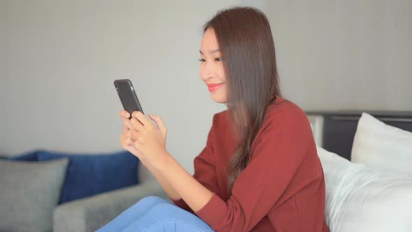 Young asian woman use smart phone