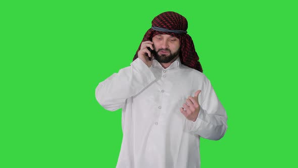 Arab Sheikh Making a Call Walking on a Green Screen, Chroma Key