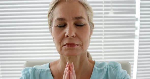 Woman relaxing with a movement of yoga