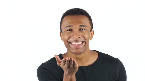 Flying Kiss by Black Man on White Background