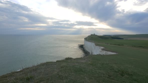 Green field of Beachy Head at sunset