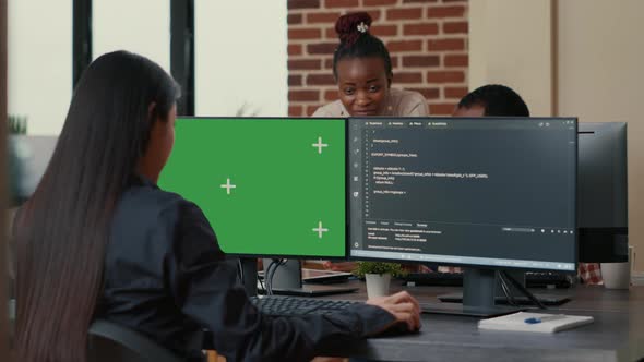 Software Developer Writing Algorithm in Front of Computer with Green Screen Chroma Key Mockup