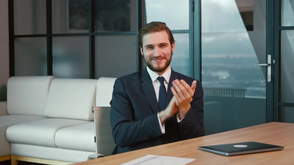 Young businessman on video conference in office.