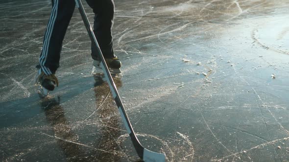 Ice Hockey Player Point of View Shot of a Puck Being Shot on Frozen Lake, Professional Player