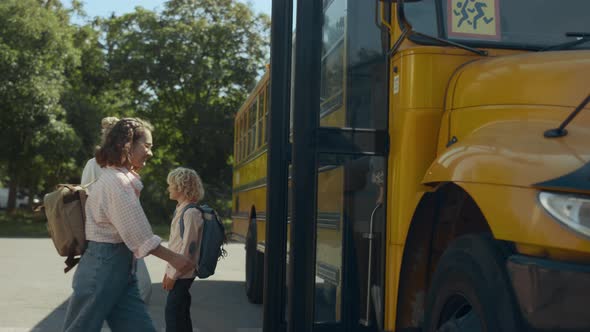 Mother Saying Goodbye Little Son Standing at Bus