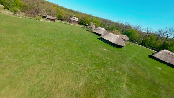 FPV Drone Flies Over the Ukrainian Authentic Village of Pirogovo with Windmills Near Kiev