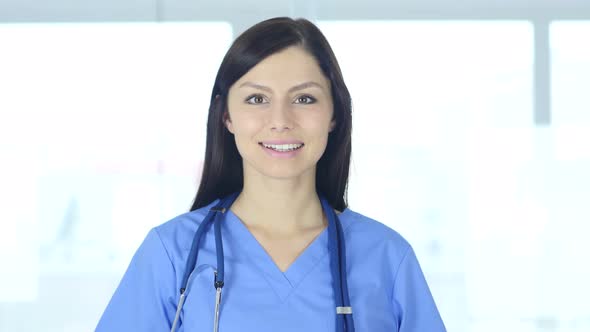 Portrait of Doctor Looking At Camera in Clinic