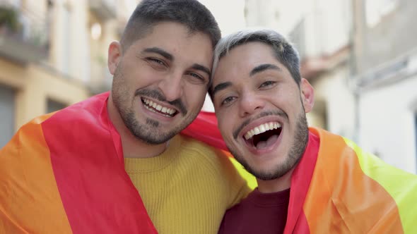 Gay Male Couple Holding Rainbow Flag at Lgbt Pride Parade  Equality Human Rights Concept
