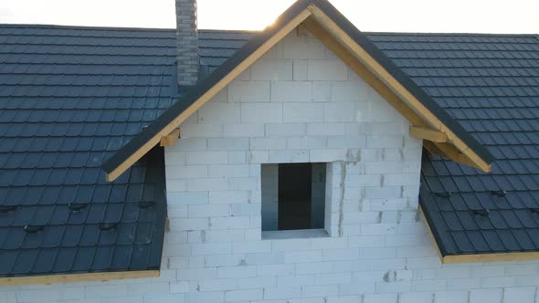 Aerial View of Unfinished House with Aerated Lightweight Concrete Walls and Wooden Roof Frame